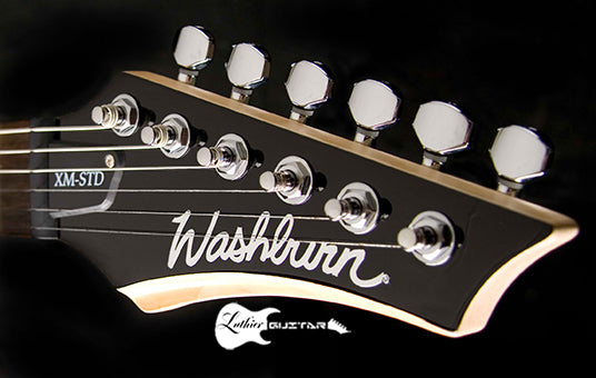 Guitar headstock with 'Washburn' branding on a black background